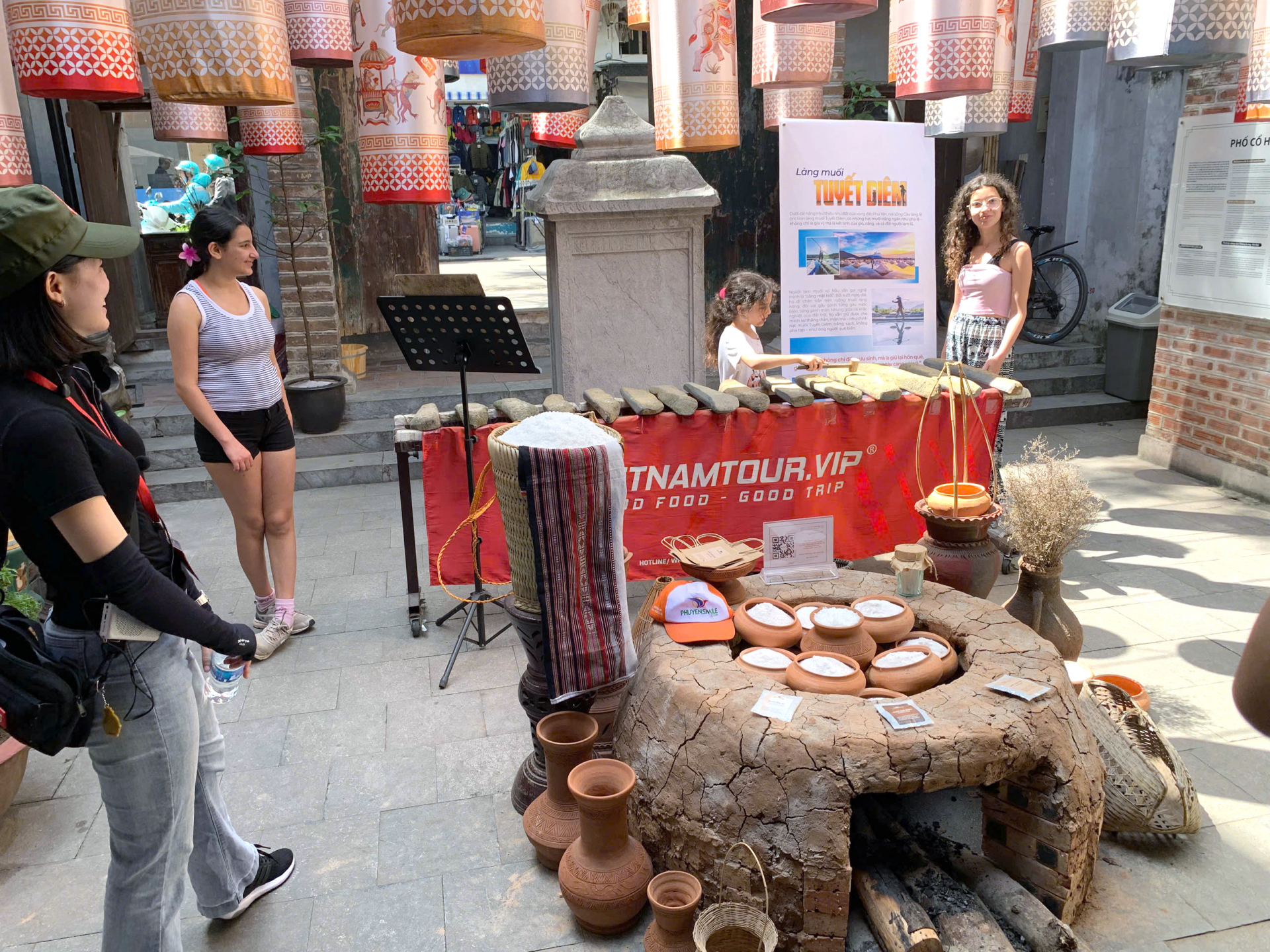 The exhibition space at 28 Hang Buom showcasing Tuyet Diem salt products and a model of a salt-boiling furnace