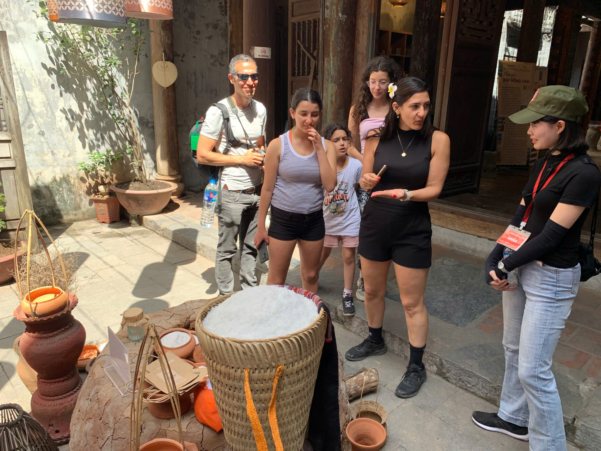 International visitors being genuinely fascinated as they learned about Tuyet Diem salt and the process of turning seawater into salt crystals
