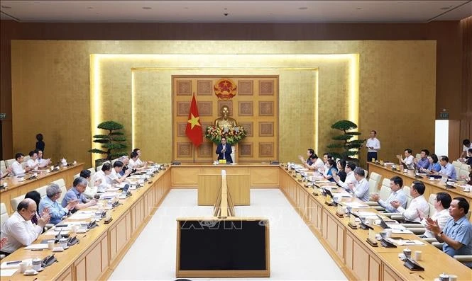 At the working session held in Hanoi on May 8. Photo: VNA