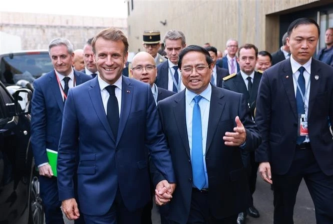 Prime Minister Pham Minh Chinh (second, right) meets with French President Emmanuel Macron on the sidelines of the 3rd UN Ocean Conference (UNOC3) in Nice, France on June 9. Photo: VNA